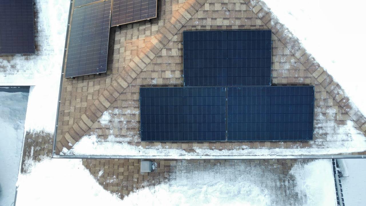 Edmonton Alberta solar panel installation rooftop winter snow case study